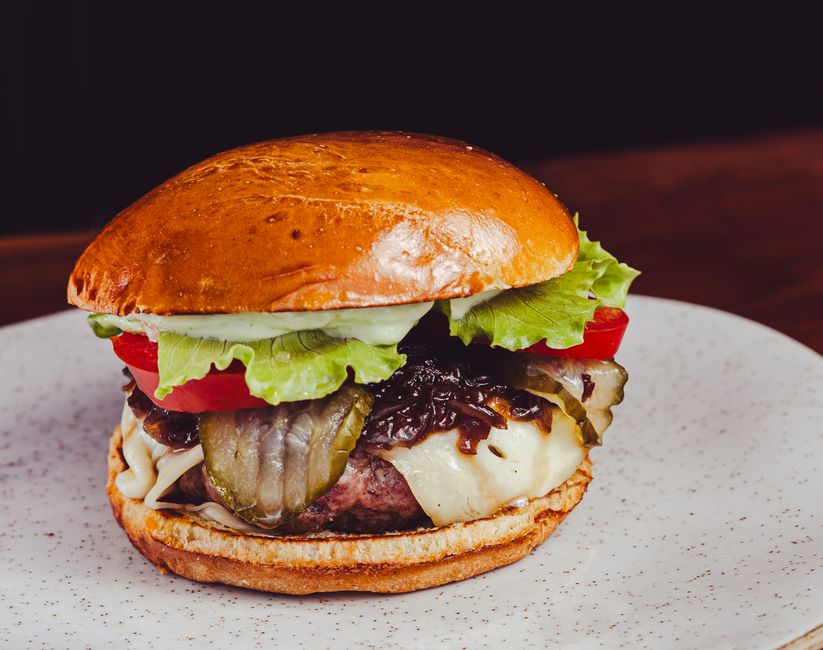 Professionally prepared gourmet burger showing quality food presentation